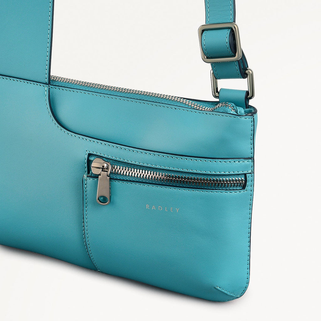 Pockets Leather Mini Ziptop Cross Body Bag in Maldives - 111448